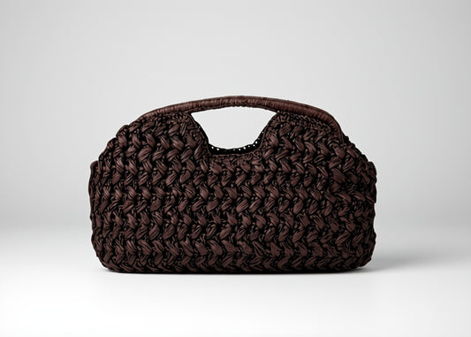 Brown woven handbag on a white background