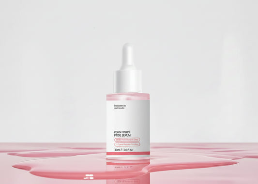 Pink Glow Serum skincare bottles with dropper packaging on a soft pink background, with one bottle open and the dropper resting above it. Text at the top reads 'PINK GLOW SERUM' and descriptive copy about uneven skin tone and elasticity care.