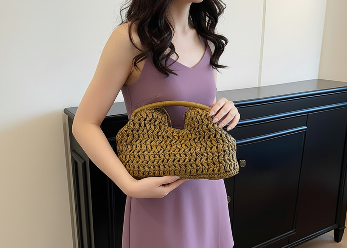 Person holding a mustard yellow woven handbag