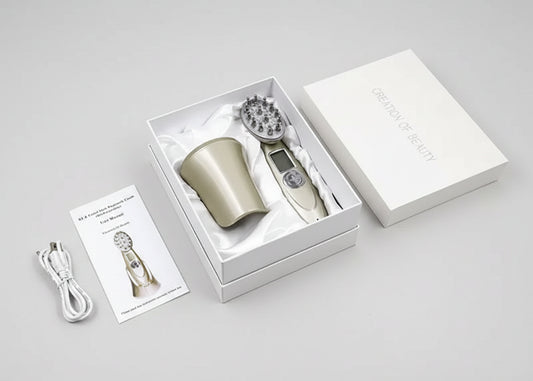Product packaging with a hair styling tool, attachments, and a manual on a white background.