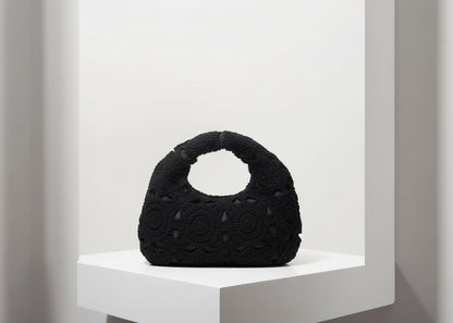 Black textured handbag on a white background with 'Random Pattern' text.
