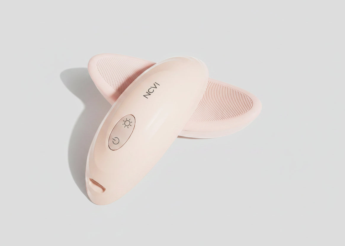 Pink skin care device with 'NCVI' branding on a white background