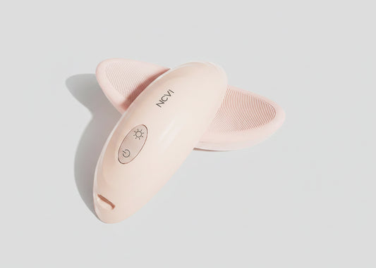 Pink skin care device with 'NCVI' branding on a white background