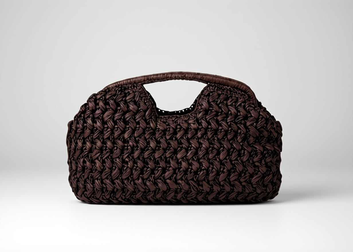 Brown woven handbag on a white background