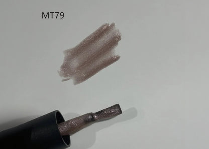 Nail polish with a glittery finish on a light gray background, labeled MT79.