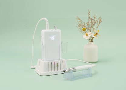 White electronic device with attachments on a light green background