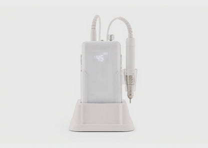 White dental device with digital display on a white background