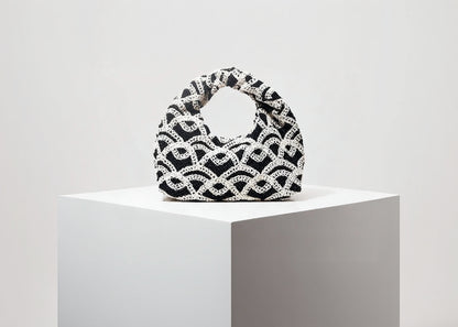 Black and white woven handbag on a white background with 'Random Pattern' text.