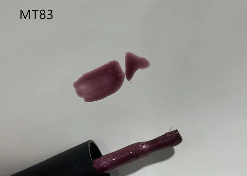 Lipstick with a swatch of color labeled MT83 on a white background