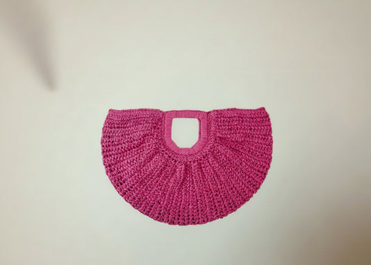 Pink woven bag on a white background