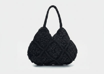 Black textured handbag on a white background