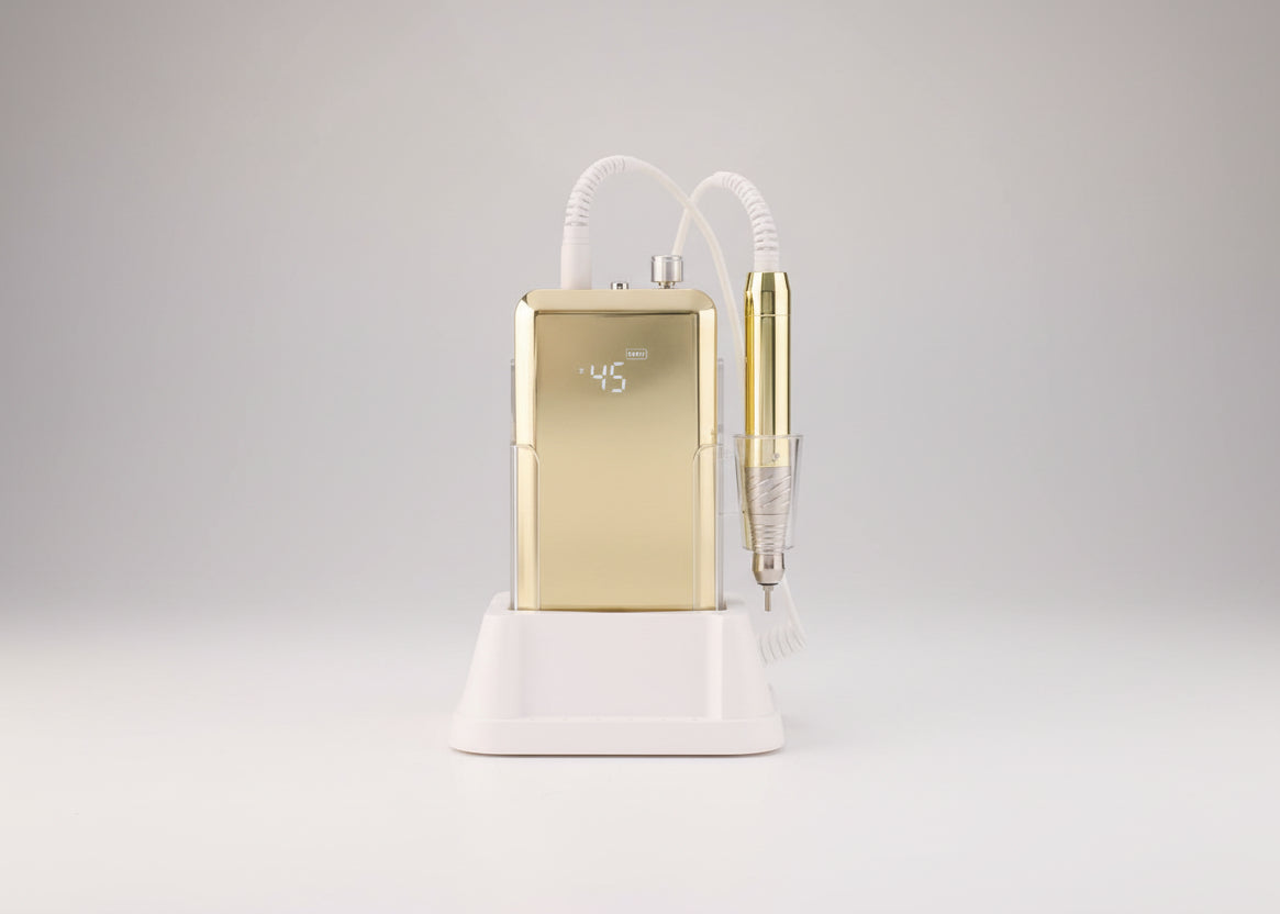 Gold dental device with white base on a white background