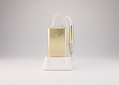Gold dental device with white base on a white background